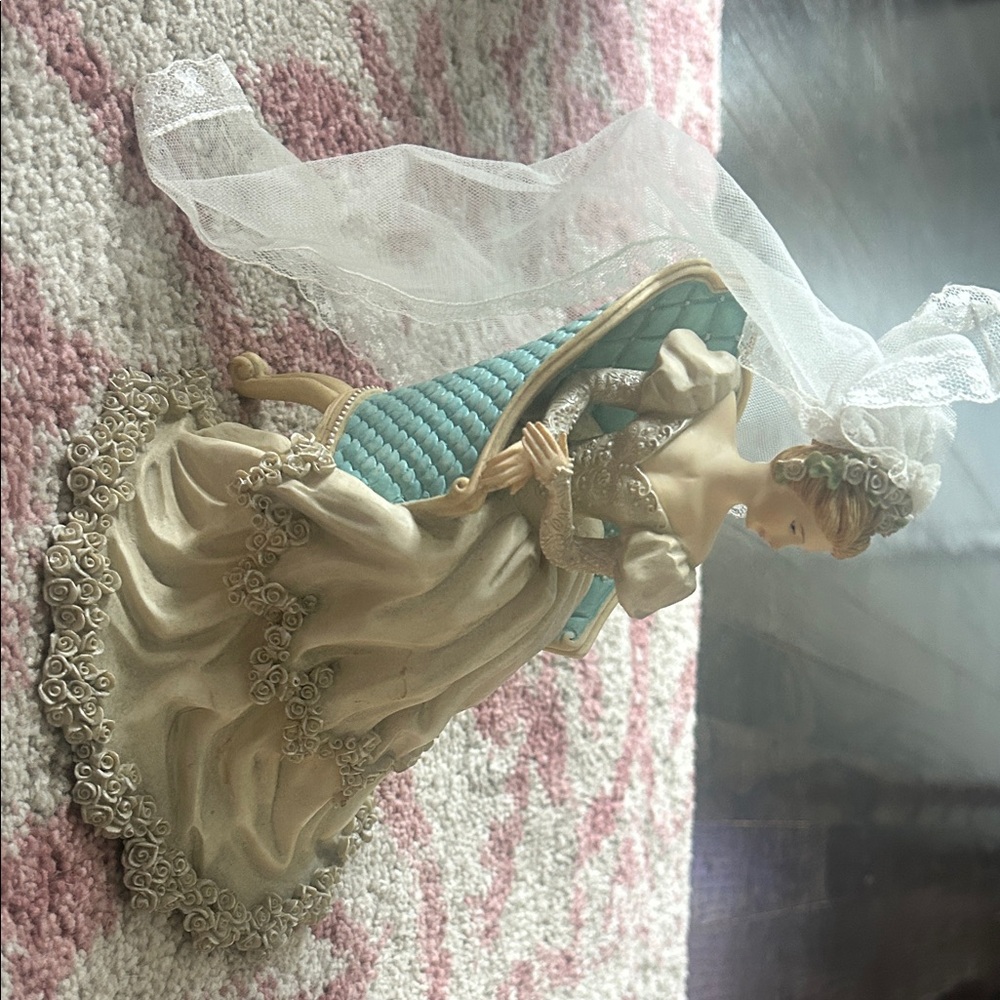 Elegant Figurine with Blue and Cream Dress